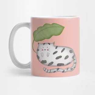 Cute cat sleeping under banana leaf Mug